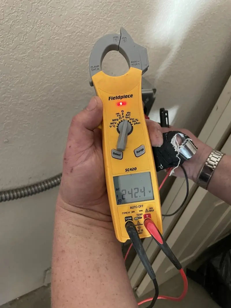 Voltage testing with clamp meter during Generator Installation in Watertown